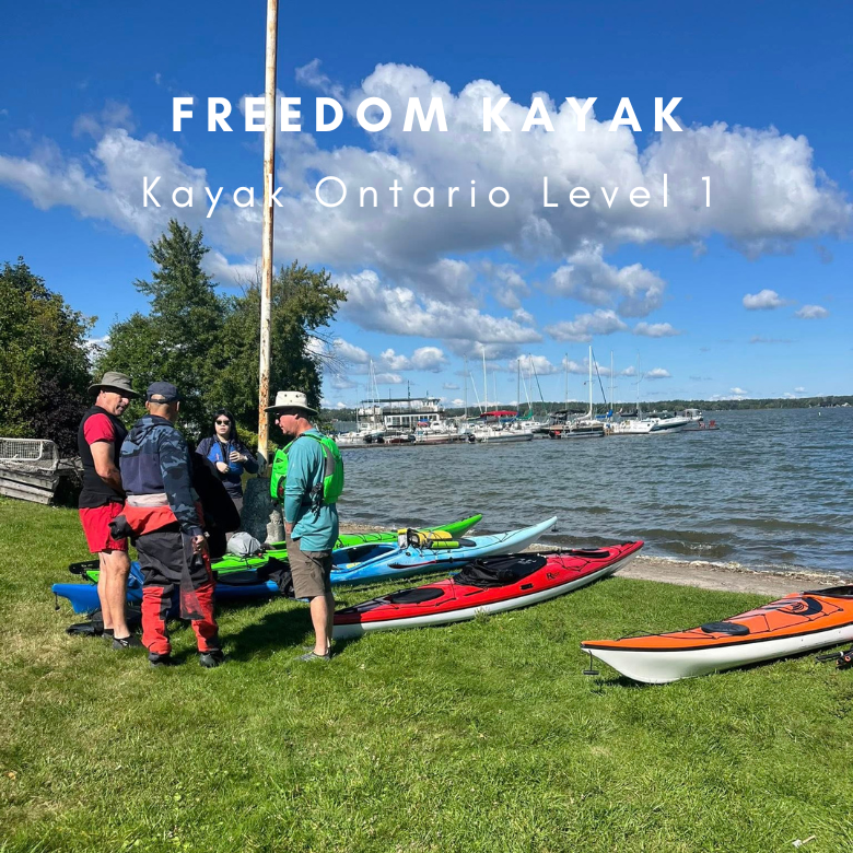 Group of people with kayaks by a lake, with 'Freedom Kayak' text overlay.