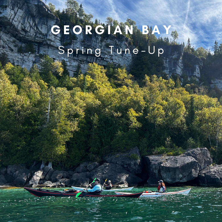 Two kayakers on a lake with rocky cliffs and trees in the background, text 'Georgian Bay Spring Tune-Up' above.